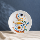 plato-llano-diseno-volutas-azul-y-naranja
